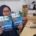 Dua buah buku diterima oleh Azhar Shofiyah, petugas Perpustakaan Satria Dharma, di lantai 4 Gedung White Campus, Kampus Utama Balikpapan, Senin (6/10/2025). Foto: SA/Kontributor